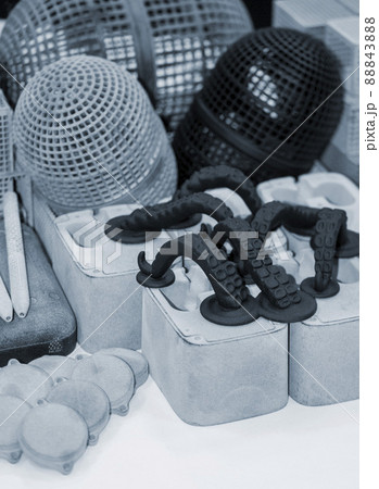 Many different objects printed on 3D printer from powder polyamide. 88843888