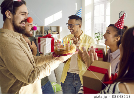 Smiling young people greeting friend with happy birthday 88848513