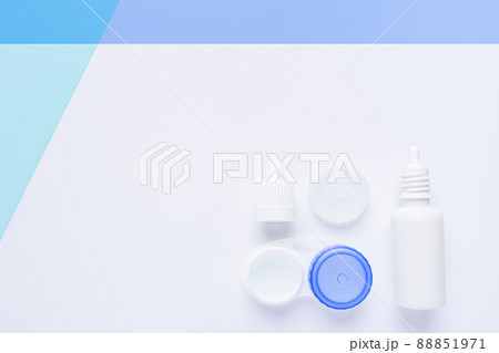 Contact lens case on white and blue background with copy space. Contact lens case on white and blue background with copy space. 88851971