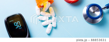 White pills on blue background White pills on blue background 88853631
