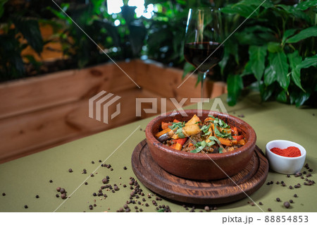 georgian ajapsandali with tomato, bell pepper or aubergine in clay bowl on table 88854853
