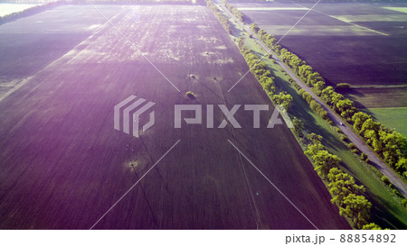 Fields in early spring summer morning from great height. Aerial drone view 88854892