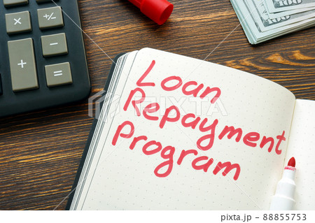 Loan repayment program inscription on the page and calculator. Loan repayment program inscription on the page and calculator. 88855753