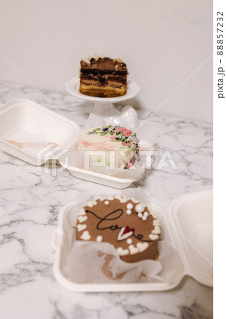 Three different bento cake on white table. Small bento cake for one person as a gift for the holiday 88857232