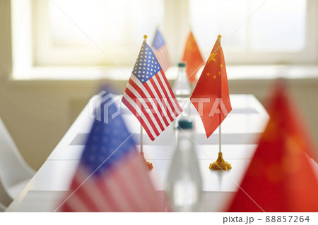 Flags of China and United States on table at meeting to discuss trade relations. Flags of China and United States on table at meeting to discuss trade relations. 88857264