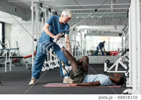 Rehabilitation Therapist with Client Rehabilitation Therapist with Client 88858150