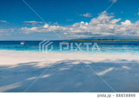 Sandy beach and blue ocean in paradise island. Holiday beach with white sand and sea water 88858866