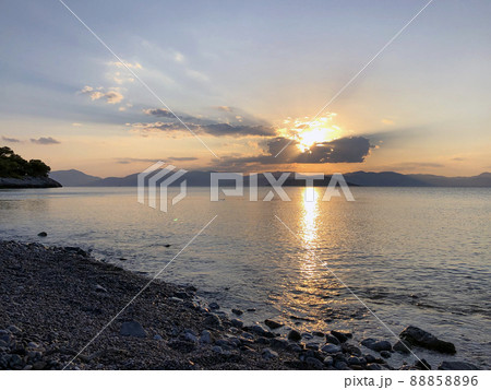 Golden Beautiful sunset at the seaside, Greece Golden Beautiful sunset at the seaside, Greece 88858896