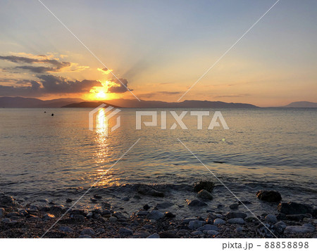Golden Beautiful sunset at the seaside, Greece Golden Beautiful sunset at the seaside, Greece 88858898