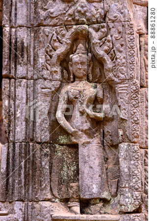 Detail of bas relief sculpture the wall of the ancient Ta Prohm temple in the Angkor Thom Area, Siem Reap, Cambodia. Detail of bas relief sculpture the wall of the ancient Ta Prohm temple in the Angkor Thom Area, Siem Reap, Cambodia. 88861280