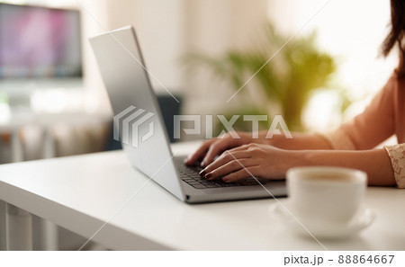 Close up asian woman using laptop computer at home Close up asian woman using laptop computer at home 88864667