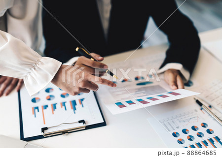 Business people adviser analyzing investment graph meeting brainstorming and discussing plan in meeting room, investment concept Business people adviser analyzing investment graph meeting brainstorming and discussing plan in meeting room, investment concept 88864685