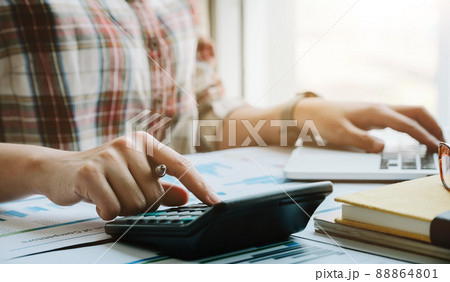 Business woman working in finance and accounting Analyze financial budget in the office Business woman working in finance and accounting Analyze financial budget in the office 88864801