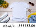 Womens white T-shirt mockup with yellow flowers 88865369