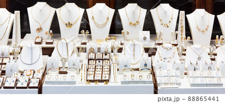 Pendants and bracelets with dimonds in jewelry store 88865441