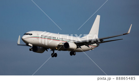 Image of passenger plane landing in airport afternoon 88865485