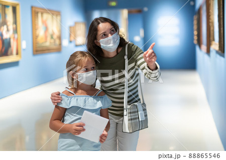 Portrait of woman with girl standing in museum of art 88865546