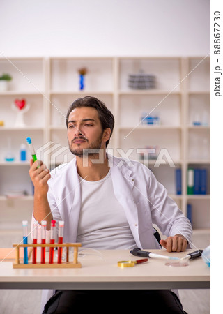 Young male chemist working at the lab 88867230