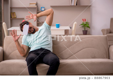 Young man student wearing virtual glasses at home Young man student wearing virtual glasses at home 88867903