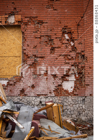 Bila Tserkva, Kyev region Ukraine - 04.03.2022: The consequences of an airstrike, a missile attack on residential buildings in Bila Tserkva. Russian troops destroy houses, people in Ukraine. Bila Tserkva, Kyev region Ukraine - 04.03.2022: The consequences of an airstrike, a missile attack on residential buildings in Bila Tserkva. Russian troops destroy houses, people in Ukraine. 88868431