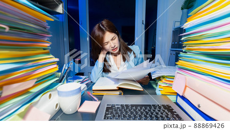 businesswoman overtime work 88869426