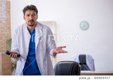 Young male doctor working in the clinic 88869447