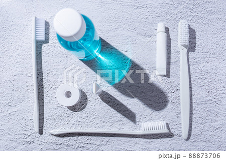 Personal dental hygiene accessories. Mouthwash, toothbrush, toothpaste and dental floss. 88873706