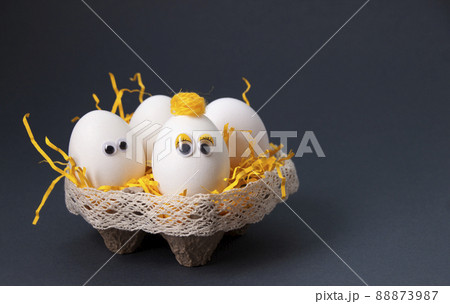 Eggs  in a stand on a dark background 88873987