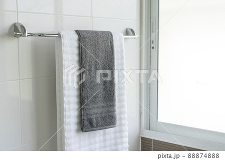 White towel on hanger rack in bathroom 88874888