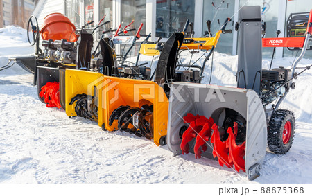 Kemerovo, Russia, February 17, 2022. A new petrol snowplow is on sale. Snow removal mechanism. A device for snow removal at home in winter. Kemerovo, Russia, February 17, 2022. A new petrol snowplow is on sale. Snow removal mechanism. A device for snow removal at home in winter. 88875368