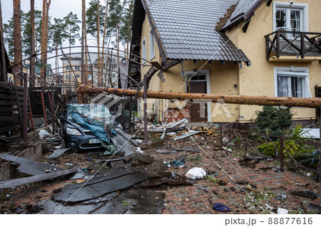 Irpin, Kyev region Ukraine - 09.04.2022: Cities of Ukraine after the Russian occupation. House and yard destroyed by Russian missiles, mines, shells. Irpin, Bucha, Gostomel. Irpin, Kyev region Ukraine - 09.04.2022: Cities of Ukraine after the Russian occupation. House and yard destroyed by Russian missiles, mines, shells. Irpin, Bucha, Gostomel. 88877616
