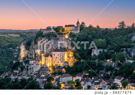 Majestic religious buildings of Rocamadour settlement lit with warm yellow illumination Majestic religious buildings of Rocamadour settlement lit with warm yellow illumination 88877874