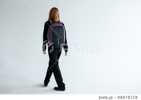 stylish hipster person holding modern backpack bag on white background stylish hipster person holding modern backpack bag on white background 88878728