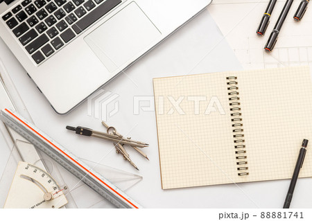 Mockup of architectural concept, Drawing tool on engineer drawing of blueprint and white background Mockup of architectural concept, Drawing tool on engineer drawing of blueprint and white background 88881741