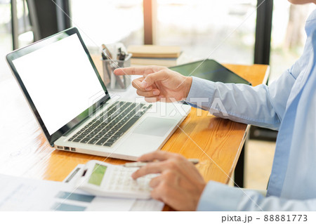 Business analyst concept the accountant using a calculator to estimate the amount of profits 88881773