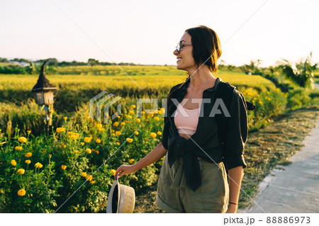 Good looking female tourist 20s recreating during getaway wanderlust journey Good looking female tourist 20s recreating during getaway wanderlust journey 88886973