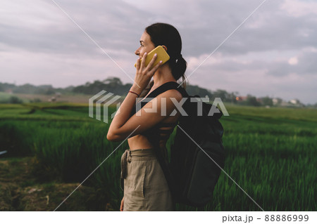 Content woman talking on cellphone Content woman talking on cellphone 88886999
