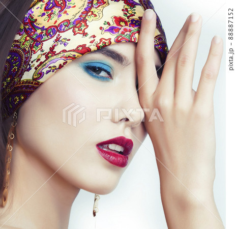 young pretty modern girl with bright shawl on head emotional posing isolated on white background, asian people ethnicity young pretty modern girl with bright shawl on head emotional posing isolated on white background, asian people ethnicity 88887152