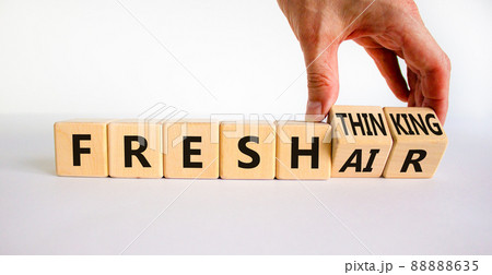Fresh thinking and air symbol. Businessman turns wooden cubes, changes words fresh thinking to fresh air. Beautiful white background. Copy space. Business, ecological, fresh thinking and air concept. Fresh thinking and air symbol. Businessman turns wooden cubes, changes words fresh thinking to fresh air. Beautiful white background. Copy space. Business, ecological, fresh thinking and air concept. 88888635