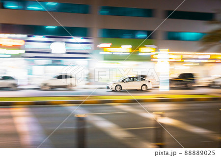 Speeding Taxi Car Fast Driving In City Street. Motion Blur Background 88889025
