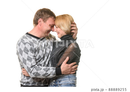 Girl and man hugging cuddled up to each other 88889255