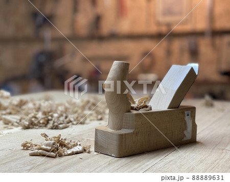 Chisel and small block plane with wood shavings. Carpenter cabinet maker hand tools on the workbench. Chisel and small block plane with wood shavings. Carpenter cabinet maker hand tools on the workbench. 88889631