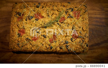 Homemade bread with rosemary, dried olives and tomatoes 88890041
