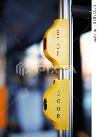 Stop button in public transport. Stop button in city bus, public transport. Red stop button for bus 88891021