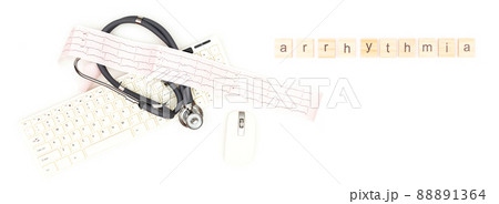 Arrhythmia. A stethoscope with an electrocardiogram sheet lying near a computer mouse and keyboard, isolated on a white background. Place to copy paste. 88891364