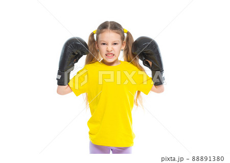 Success in martial arts sport and rivalry concept. The girl shows her teeth and gesticulates readiness for the bolra. Isolated on white background. 88891380
