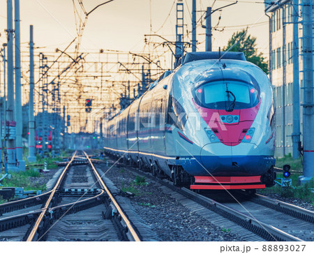 Passenger train approaches to the platform. 88893027