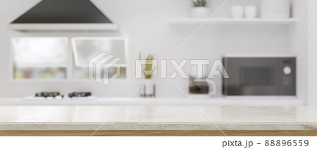 Modern kitchen tabletop with copy space against blurred modern kitchen interior 88896559