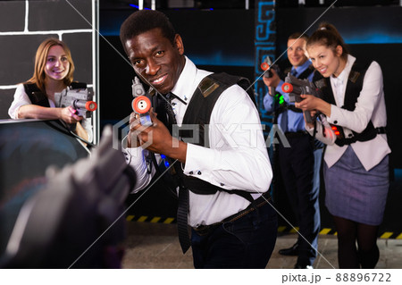 African businessman playing laser tag 88896722