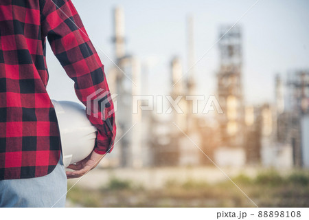 Refinery woman engineer oil industry hands hold worker helmet hard hat. Refinery industry engineering. Engineer woman hands holding hardhat white work helmet hard hat for Construction Engineering 88898108